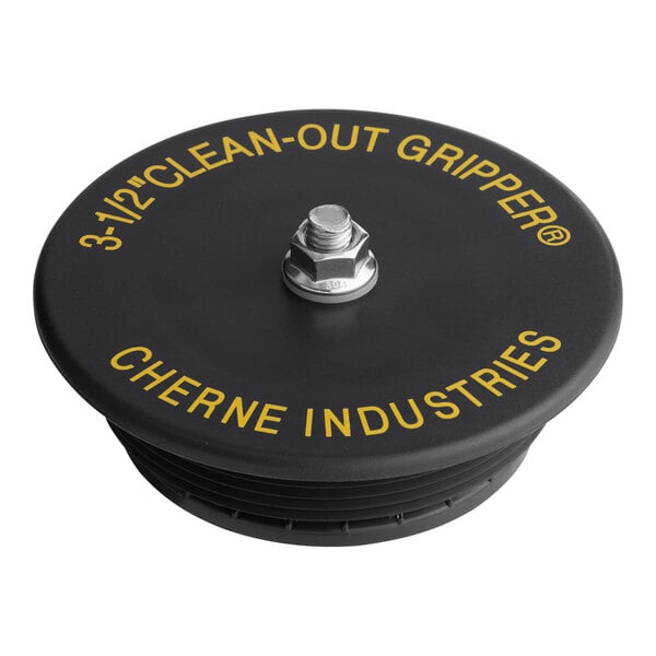 A black Cherne Clean-Out Gripper Plug on a table.
