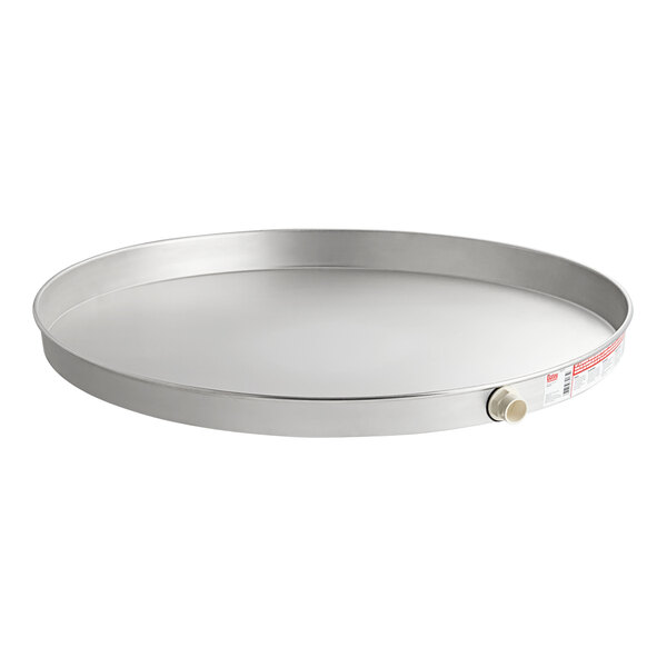 An aluminum round tray with a white label.