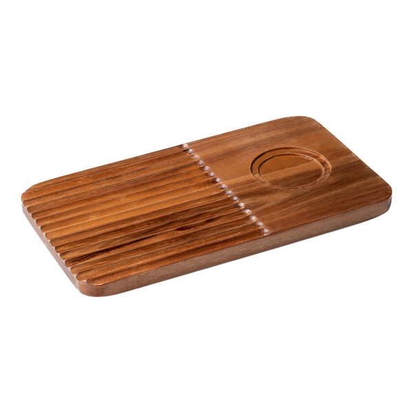 An Arcoroc rectangular wooden serving board with a well in the middle.