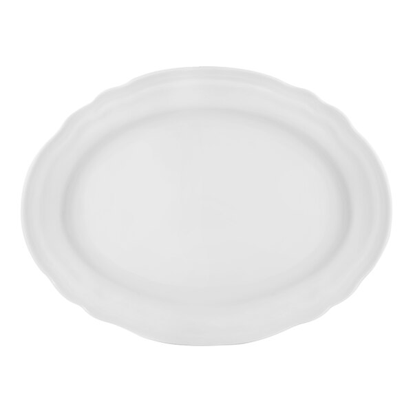 A white porcelain oval platter with a scalloped rim.