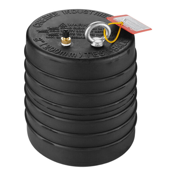 A black rubber cylinder with a yellow tag.