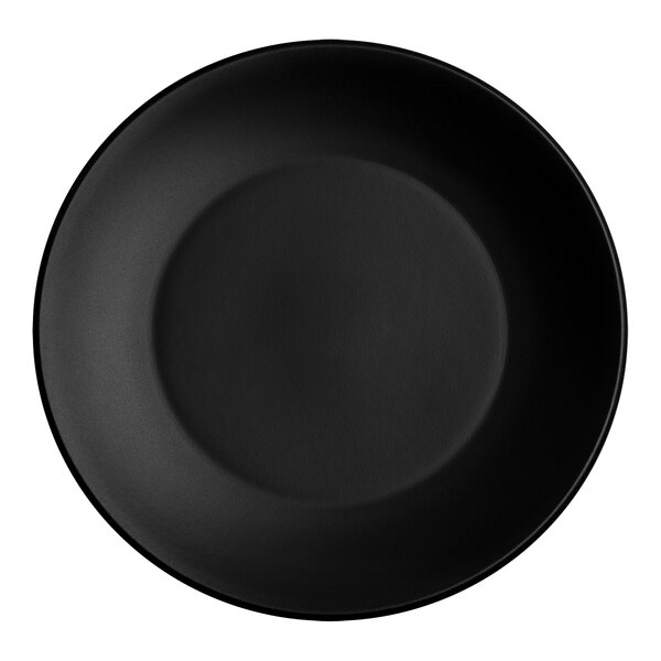 A close-up of a black Santa Anita Reflections onyx stoneware coupe plate with a black rim.