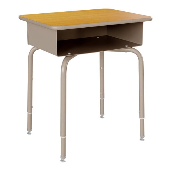 A Flash Furniture student desk with a maple laminate top and silver metal legs with a shelf on it.