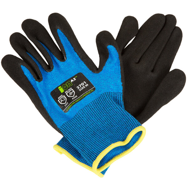 A pair of blue and black Cordova iON work gloves with a black nitrile palm coating.