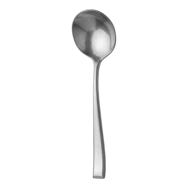 A Sola the Netherlands stainless steel soup spoon with a round bowl and a vintage design.