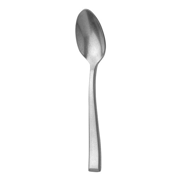 A Sola stainless steel demitasse spoon with a silver handle on a white background.