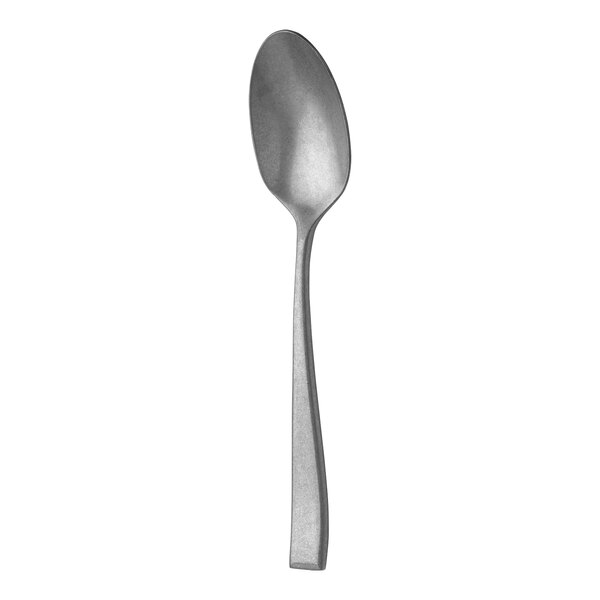 A close-up of a Sola the Netherlands stainless steel dessert spoon with a silver handle.