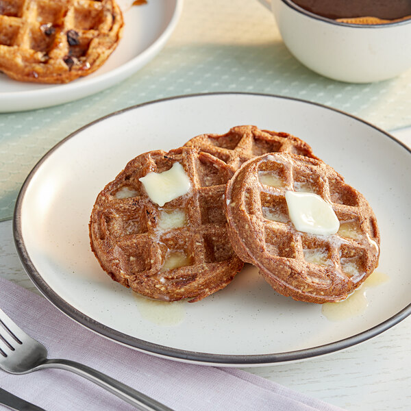 A plate of Swapples vegan cinnamon waffles with butter on top.