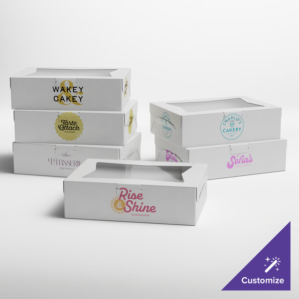 A set of white customizable window cake and bakery boxes with various printed logos.