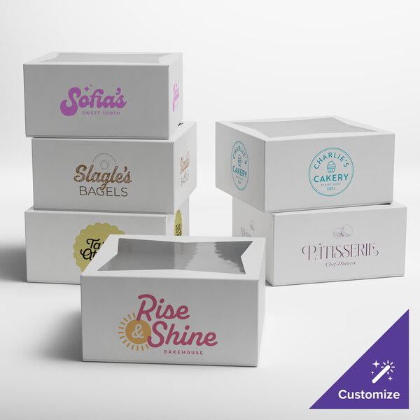 A set of white customizable bakery boxes with clear window tops, each featuring different bakery logos and designs.