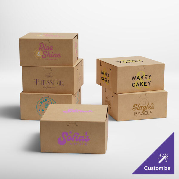 A group of brown Baker's Lane pie boxes with black, purple, and pink text on them.