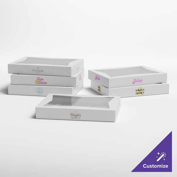 A set of white customizable bakery boxes with clear window tops, designed for donuts or baked goods.