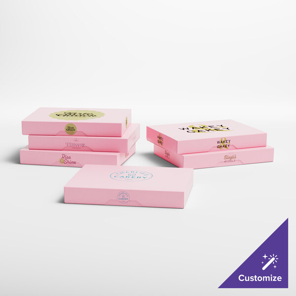 A group of pink Baker's Lane donut boxes with different designs.