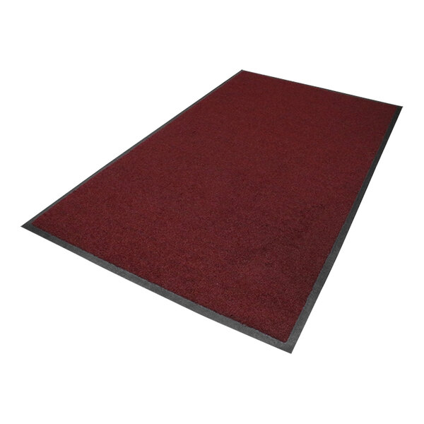 A burgundy mat with black rubber border.