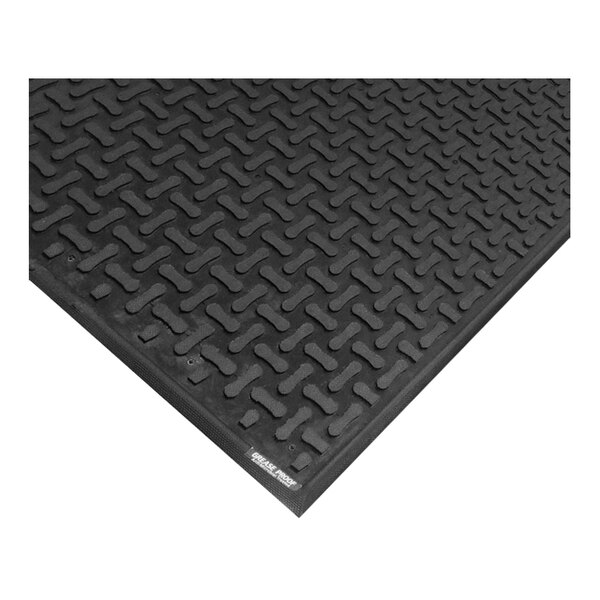 A black rubber M+A Matting anti-fatigue mat with a square pattern.