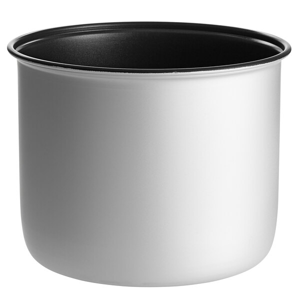 A close-up of a white and black metal pot with a lid.