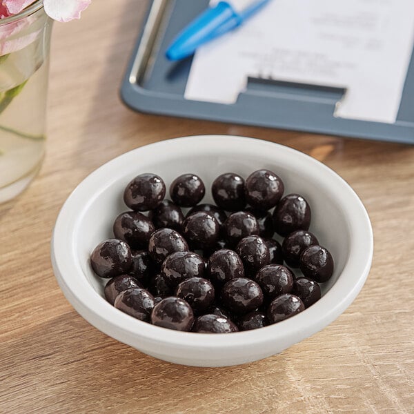 A bowl of chocolate covered espresso beans.