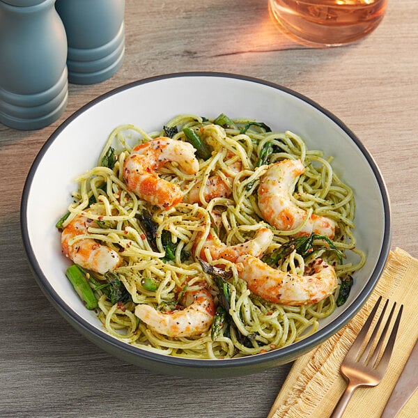A bowl of pasta with Beleaf Plant-Based Vegan jumbo shrimp and vegetables.