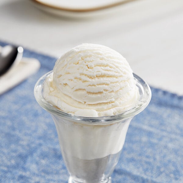 A glass cup with a scoop of I. Rice lemon ice cream.