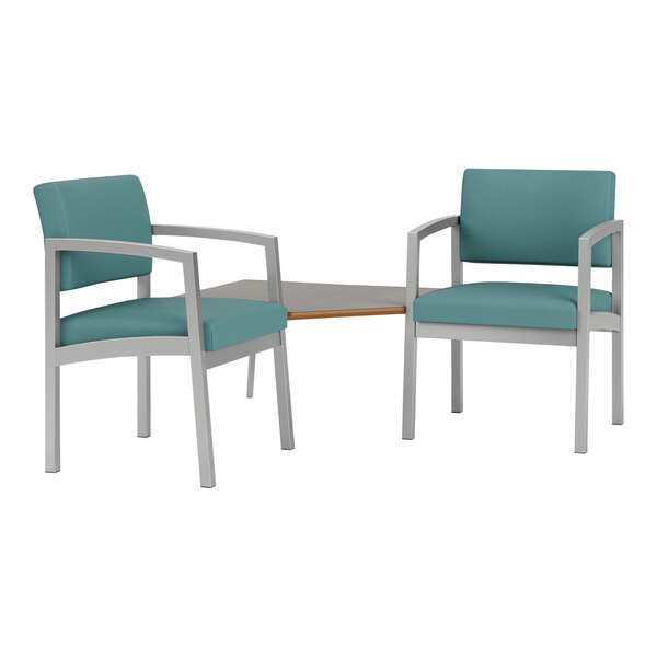 Two Lesro Lenox steel chairs with blue cushions around a laminate table.