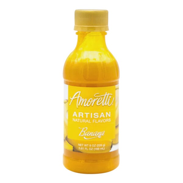 A close-up of a yellow bottle of Amoretti Banana Artisan Natural Flavor Paste with a yellow cap.