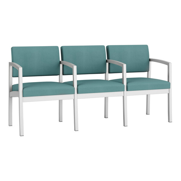 A group of Lesro Lenox steel 3-seat sofas with teal vinyl and white legs.