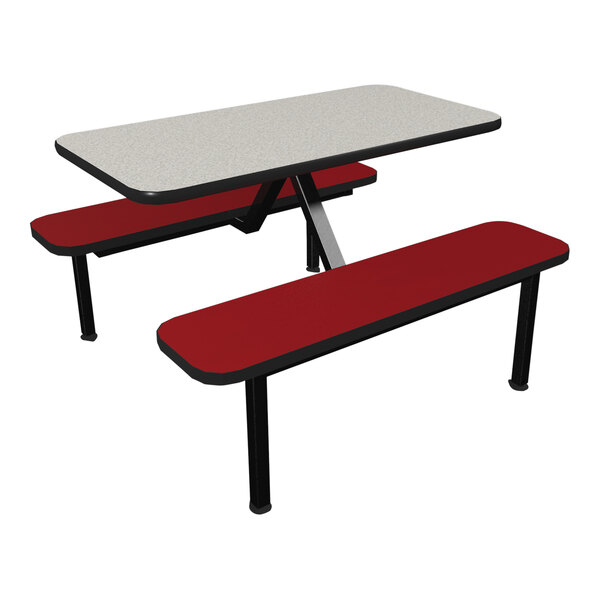 A white Plymold table with red and black benches with red seating and black legs.