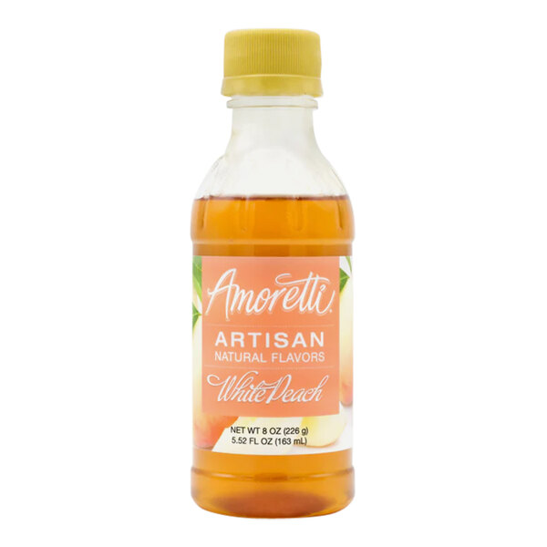 A close up of a bottle of Amoretti White Peach Artisan Natural Flavor Paste with a label and yellow plastic cap.