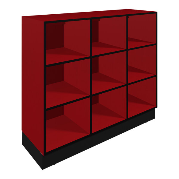 A red Plymold lunch box cubbie with black shelves.