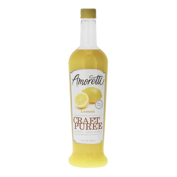A bottle of Amoretti Lemon Craft Puree with a lemon and a lemon wedge.