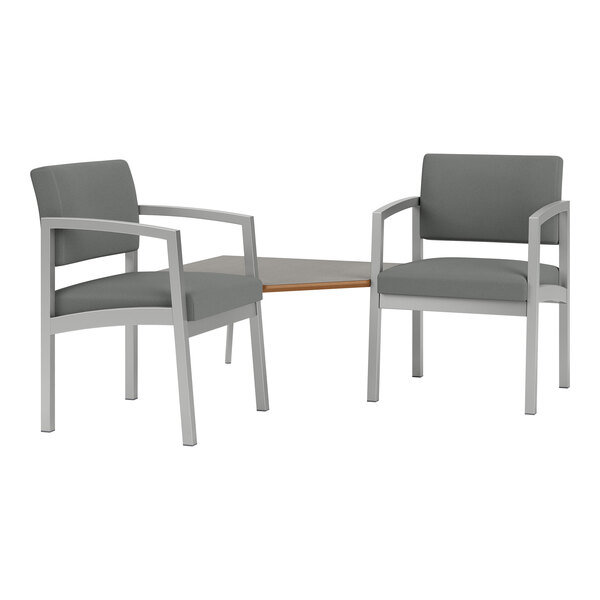 Two grey Lesro Lenox arm chairs with a connecting table.