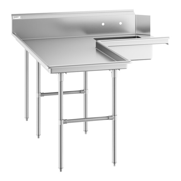 A stainless steel L-shaped table with a raised edge, backsplash, and an integrated sink on the right side, supported by multiple legs.