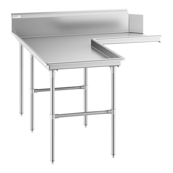 A stainless steel L-shaped table with a backsplash and multiple legs for support.