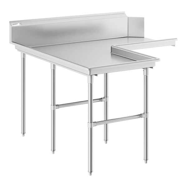 A stainless steel L-shaped table with a raised edge and backsplash, supported by multiple metal legs.