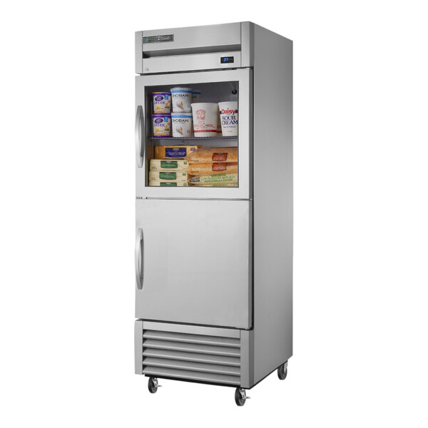 A silver True reach-in refrigerator with glass and solid half doors open.