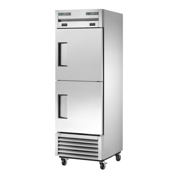 A stainless steel True combination refrigerator/freezer on wheels with black handles.