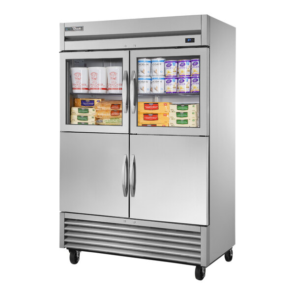 A True reach-in refrigerator with glass and solid half doors open.