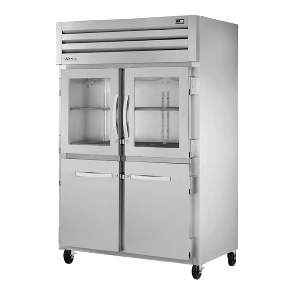 A True reach-in refrigerator with glass and solid half doors.