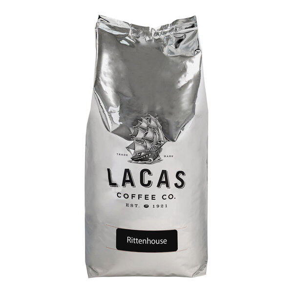 A white bag of Lacas Coffee Rittenhouse Whole Bean Coffee with a logo.