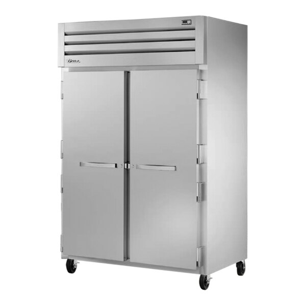 A True Manufacturing white reach-in freezer with two solid doors.