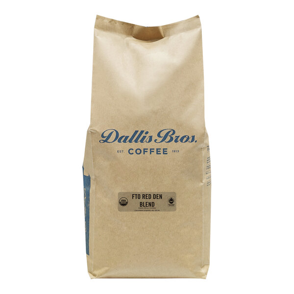 A white bag with blue text reading "Dallis Bros Fair Trade Organic Red Den Blend Whole Bean Coffee"