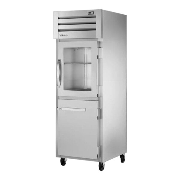 A True white and silver reach-in refrigerator with a glass half door.