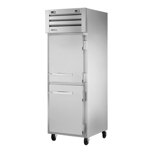 A white True Spec Series combination refrigerator/freezer with silver handles.