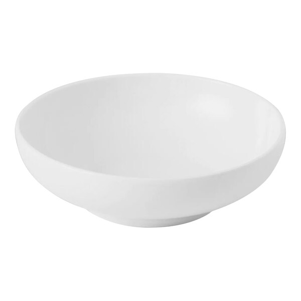 A Bon Chef Nuova bright white porcelain coupe bowl with a white background.