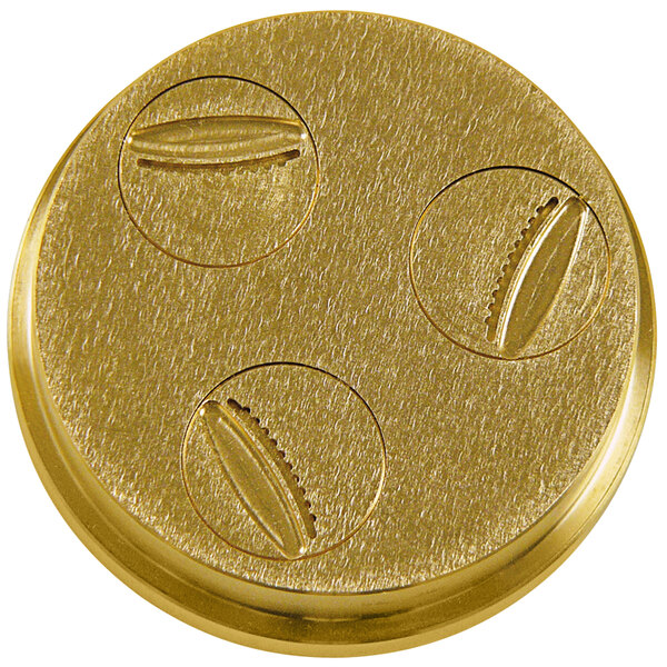 A gold circular object with three circular objects, each with one hole in it.