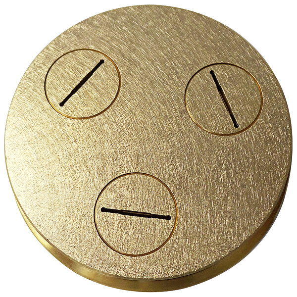 A circular brass plate with three holes in it.