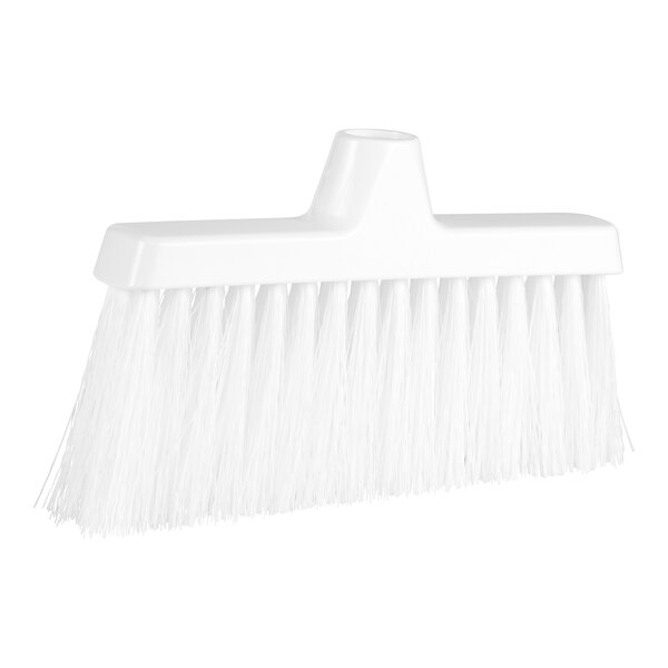 A white broom head with long bristles.