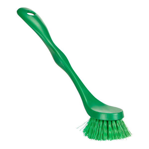A close up of a Remco green dish brush with a handle.