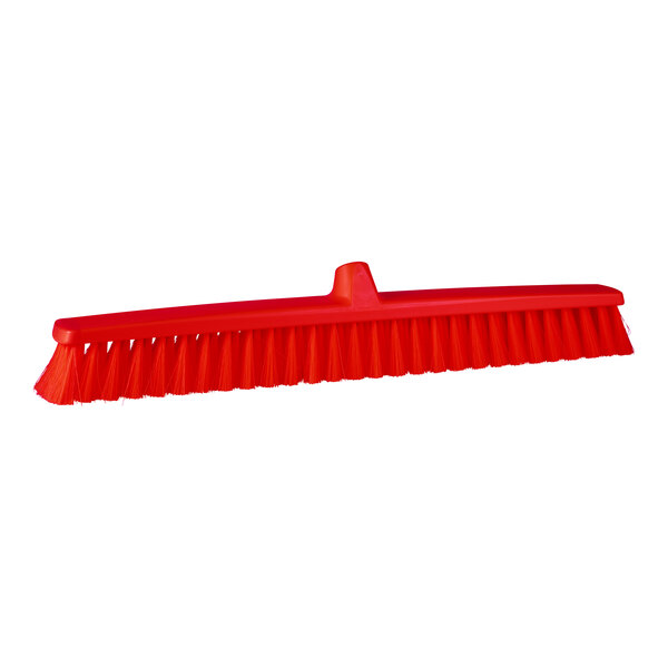A red Remco push broom head.
