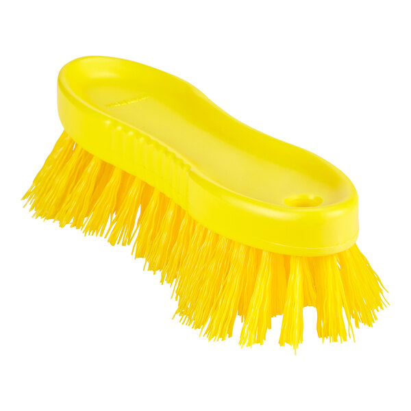 A yellow Remco ColorCore scrubbing brush with long bristles and a handle.